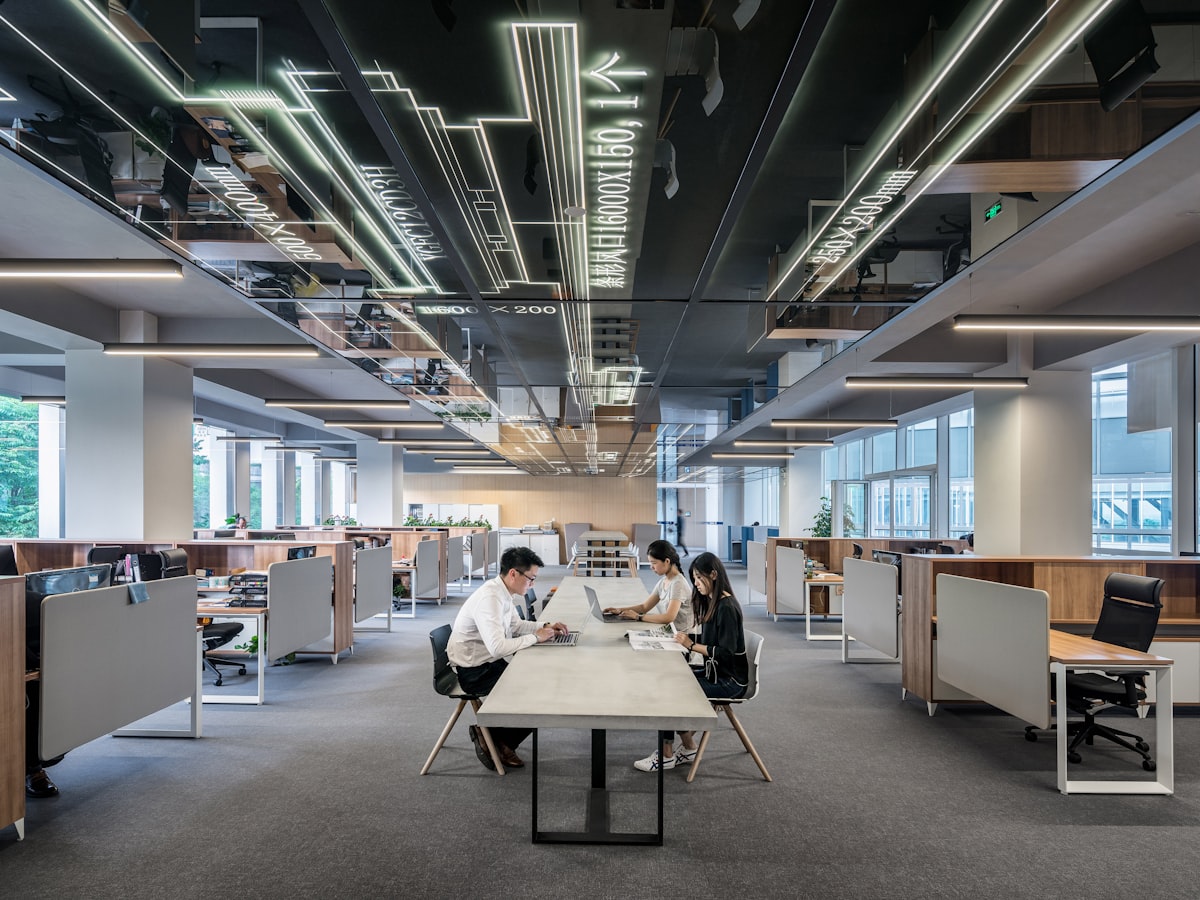 Team members working together at their desks